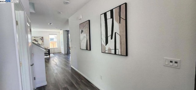 corridor featuring dark wood-type flooring