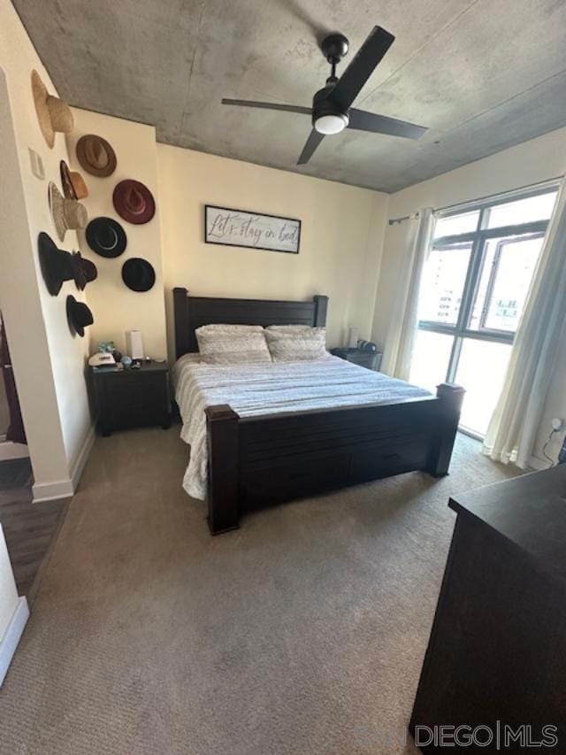 carpeted bedroom featuring ceiling fan