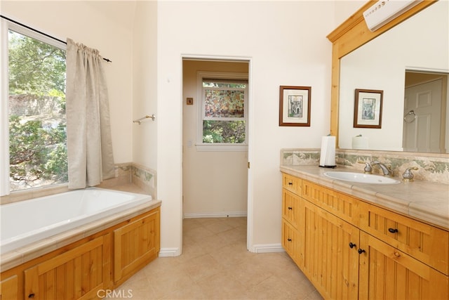 bathroom with a tub to relax in and vanity