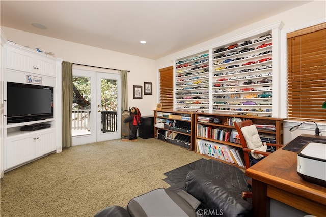 carpeted office with french doors