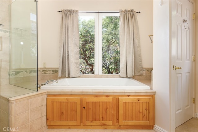 bathroom featuring a tub to relax in