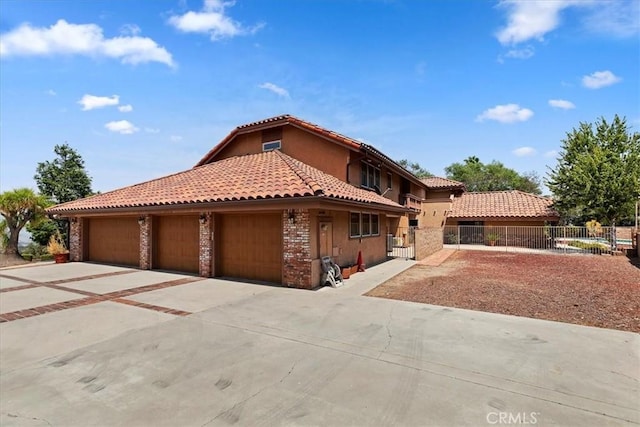 mediterranean / spanish house featuring a garage