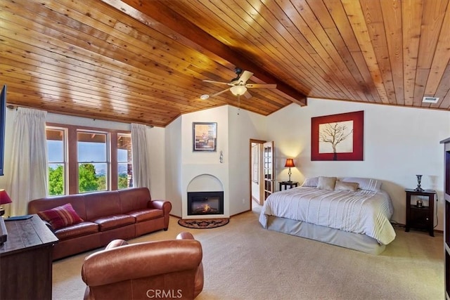 carpeted bedroom featuring ceiling fan, lofted ceiling with beams, and wood ceiling