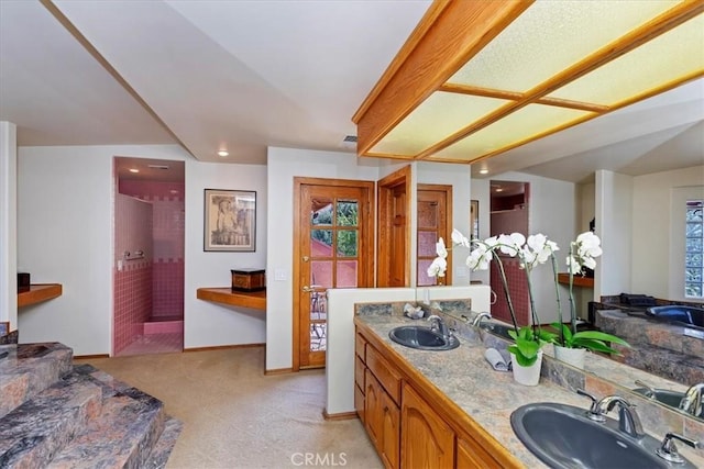 bathroom with vanity and walk in shower