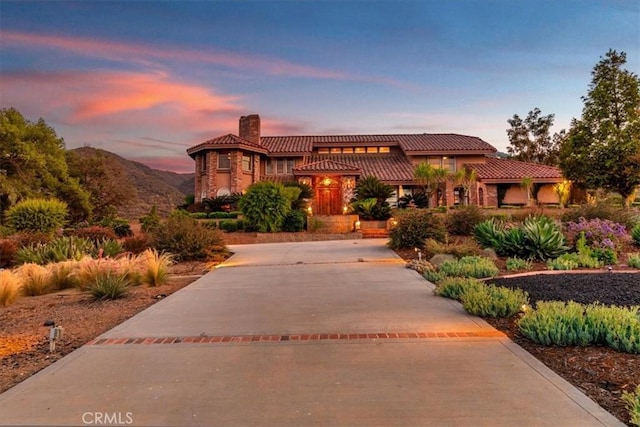 mediterranean / spanish house featuring a mountain view