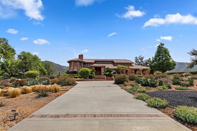 mediterranean / spanish-style home with a mountain view