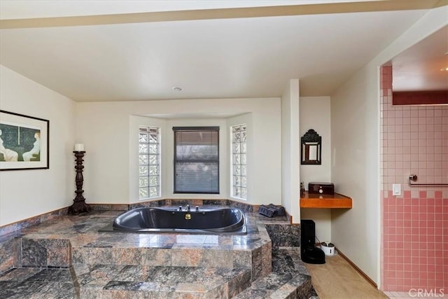 bathroom with tiled tub