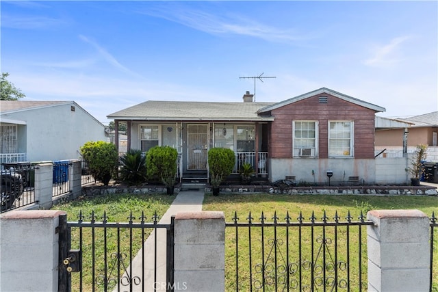 view of front of property featuring cooling unit, a front lawn, and covered porch