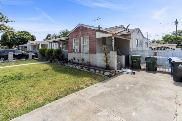 bungalow with a front yard