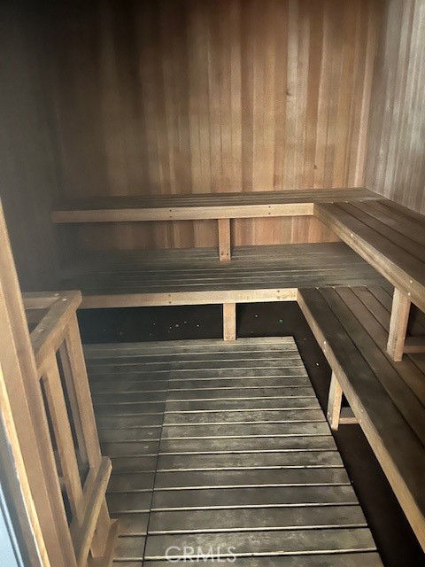 view of sauna / steam room with wood walls