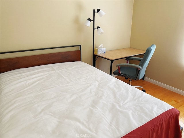 bedroom featuring hardwood / wood-style flooring