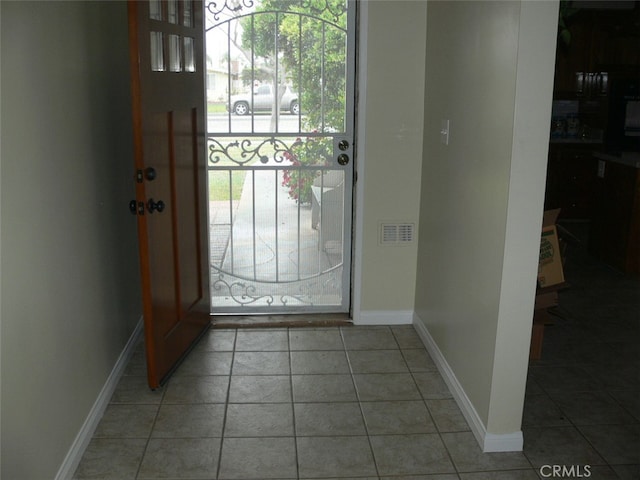 foyer entrance featuring tile patterned flooring