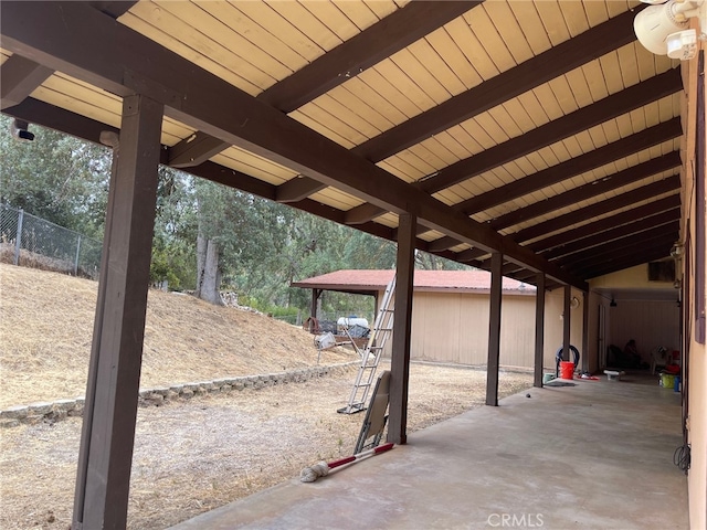 view of patio featuring an outbuilding