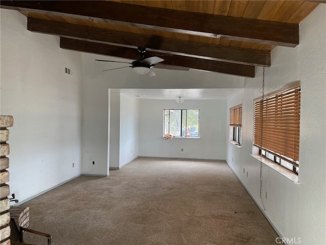 empty room featuring light carpet, lofted ceiling with beams, wooden ceiling, and ceiling fan