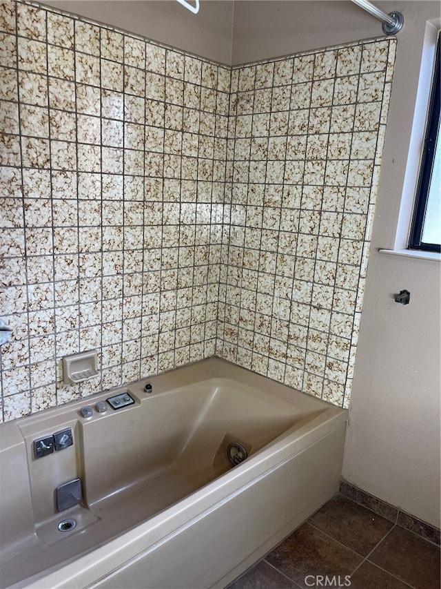 bathroom featuring tub / shower combination and tile patterned flooring