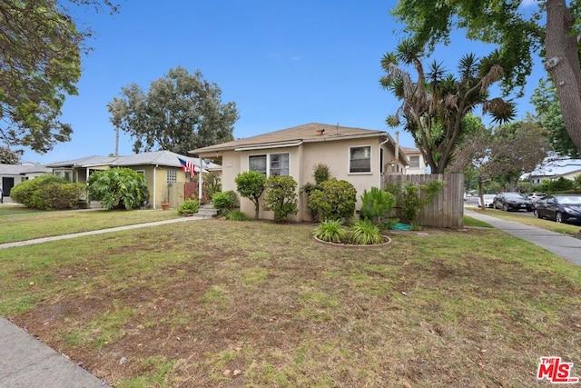 view of front facade with a front yard