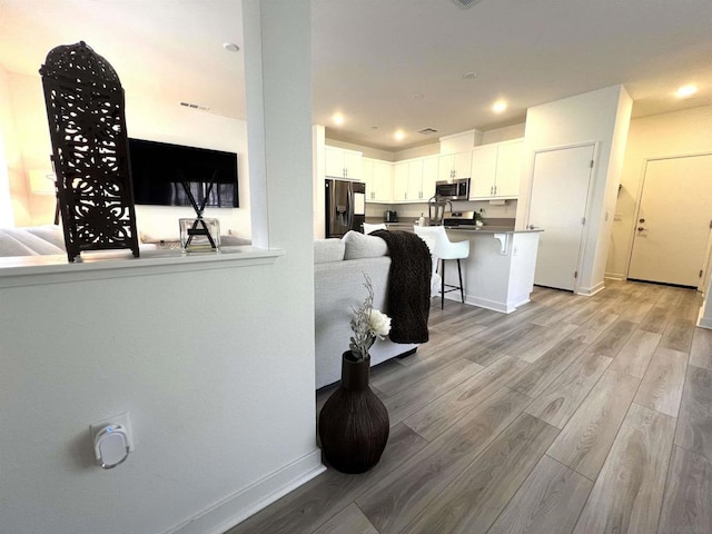 interior space with light hardwood / wood-style floors