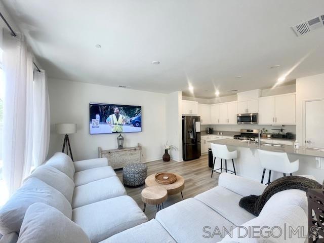 living room with light hardwood / wood-style floors