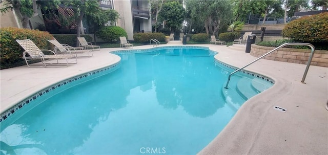 pool with a patio