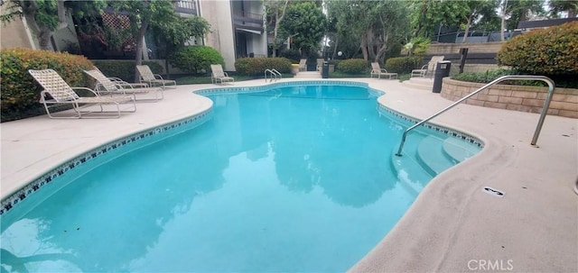 pool featuring a patio area