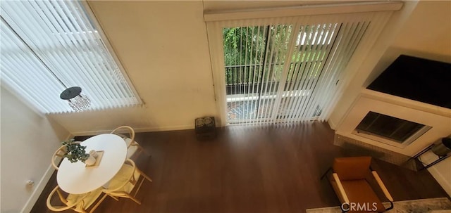 living room with dark wood-style flooring and baseboards