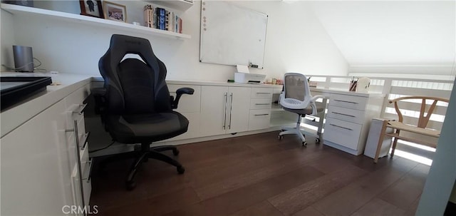 office featuring dark wood-style flooring, vaulted ceiling, and built in desk