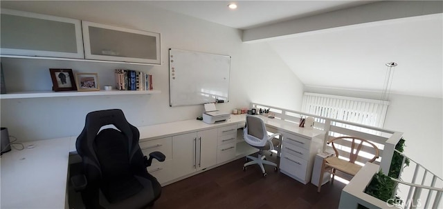 office featuring lofted ceiling with beams, built in desk, and dark wood-style floors