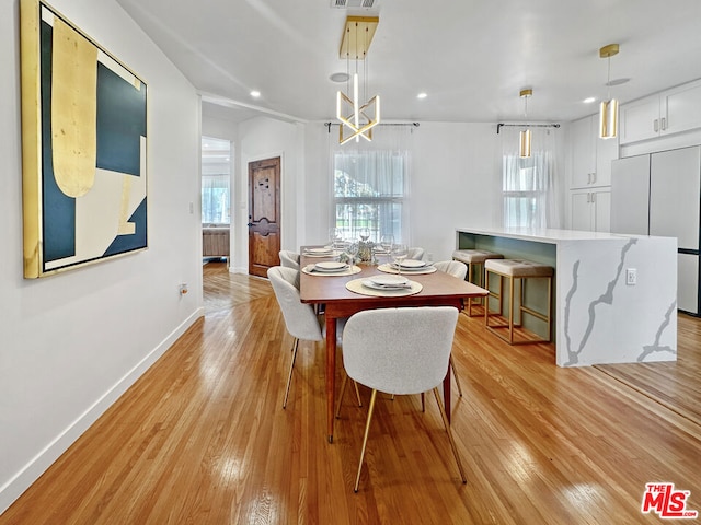 dining room with light hardwood / wood-style flooring