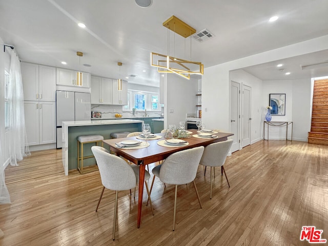 dining room featuring light hardwood / wood-style floors