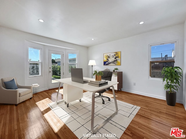 office space with light wood-type flooring