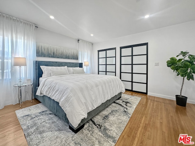 bedroom with hardwood / wood-style flooring