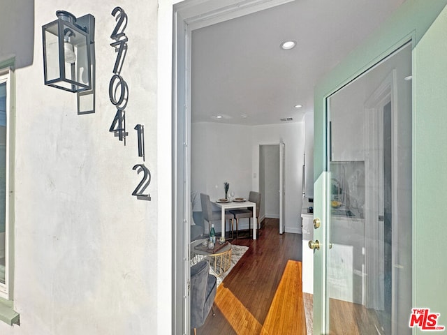 hallway featuring wood-type flooring