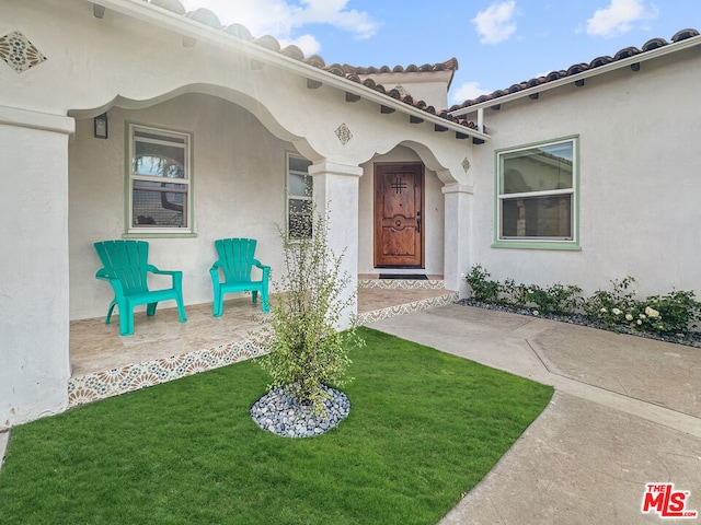 entrance to property with a yard