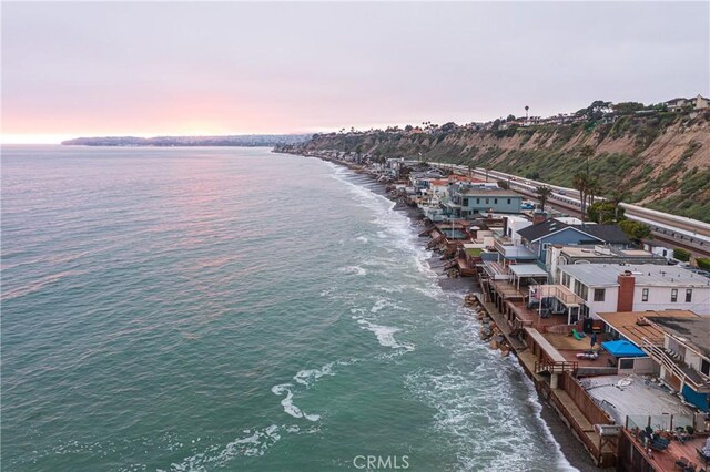 aerial view at dusk with a water view