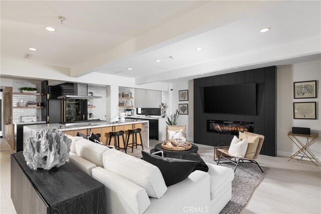 35651 Beach Rd, Dana Point, CA 92624 - living room with recessed lighting, beam ceiling, and a large fireplace