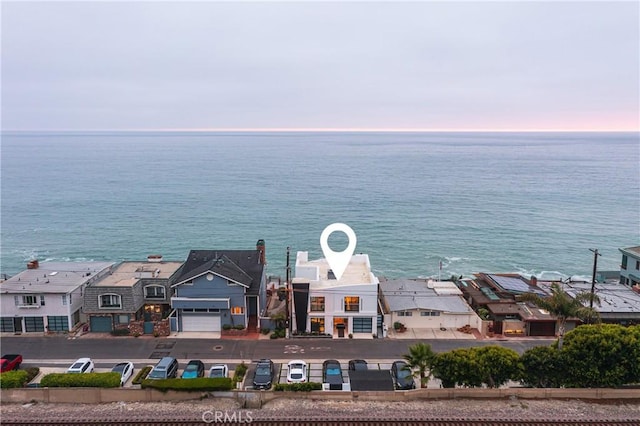 aerial view at dusk with a water view