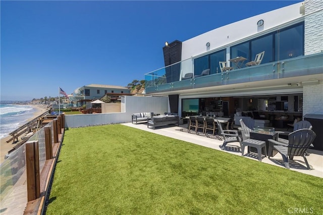 35651 Beach Rd, Dana Point, CA 92624 - view of green lawn featuring an outdoor living space, a patio area, and a water view
