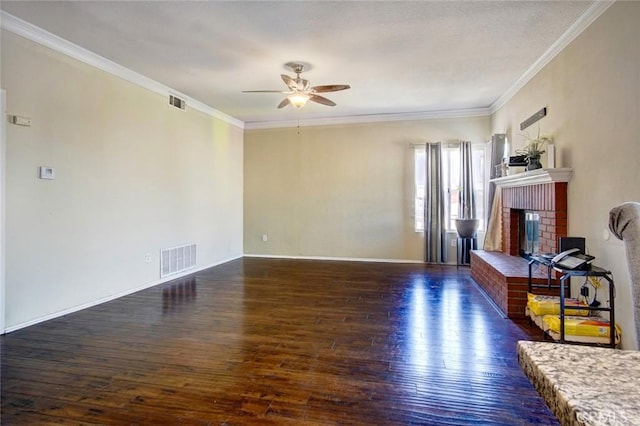 living room with crown molding, a brick fireplace, dark hardwood / wood-style floors, and ceiling fan