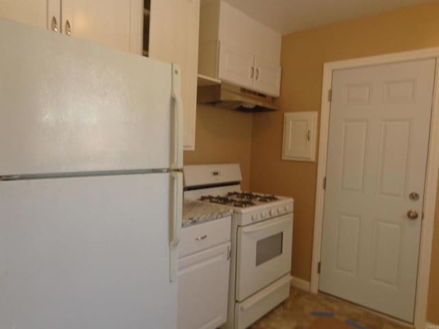 kitchen featuring white cabinetry and white appliances