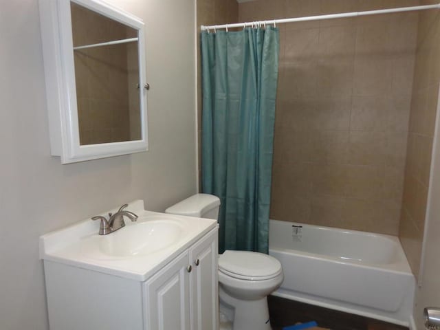 full bathroom with shower / tub combo, vanity, and toilet