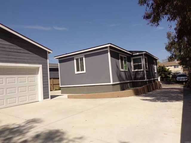 view of property exterior featuring a garage