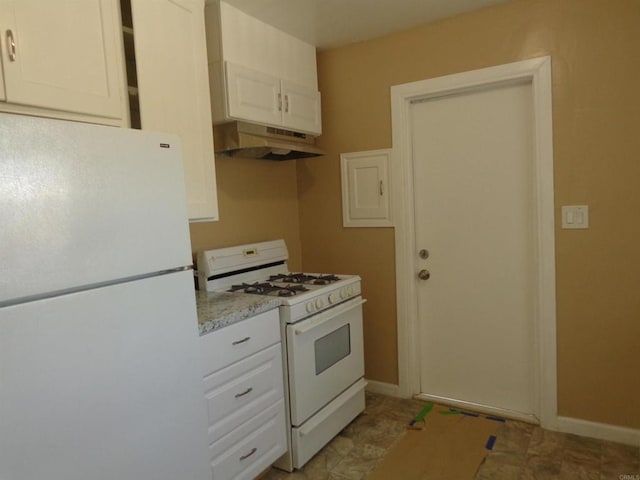 kitchen with light stone countertops, white appliances, and white cabinetry