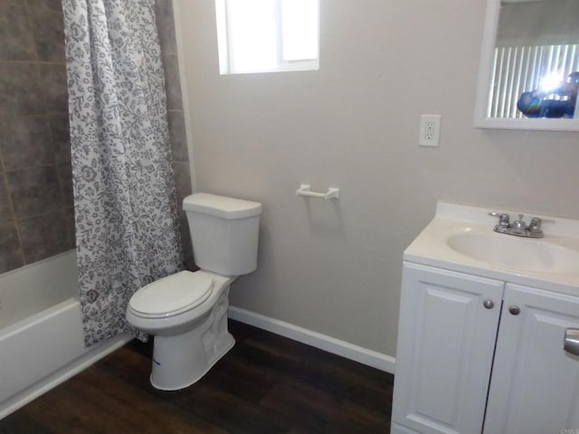 full bathroom with hardwood / wood-style floors, vanity, toilet, and shower / bathtub combination with curtain