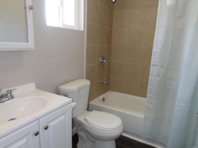 full bathroom with vanity, toilet, and shower / bath combo with shower curtain