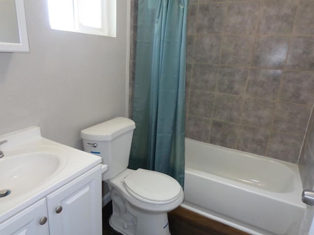 full bathroom with vanity, toilet, and shower / bath combo with shower curtain