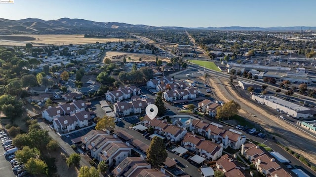 birds eye view of property with a mountain view