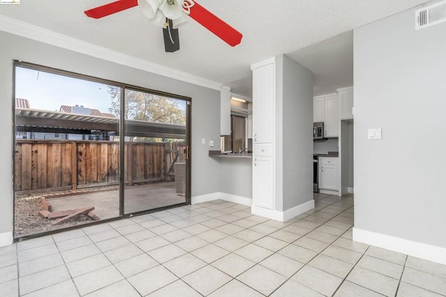 unfurnished living room with light tile patterned floors, a textured ceiling, ceiling fan, and crown molding