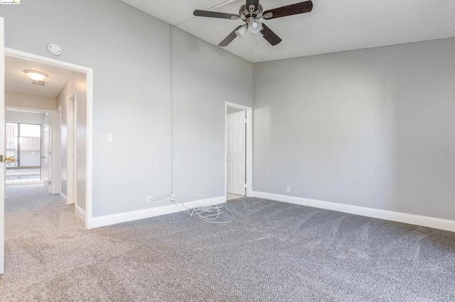 empty room with carpet and ceiling fan