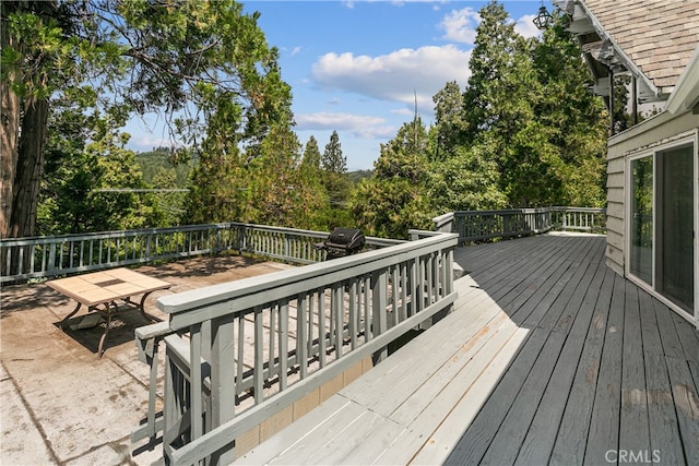 wooden terrace with grilling area