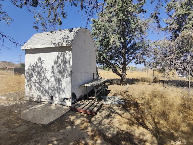 view of property exterior featuring a shed